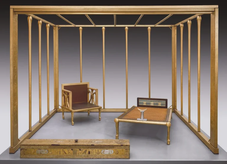 An exact replica of Hetepheres' Bedroom set, in the Boston Museum of fine arts. The set contains a square canopy with numerous thin vertical pillars all plated in gold foil. There is also a chair, a bed and head rest and the box for the canopy set. All are covered in gold foil.